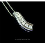 A boxed, 18 ct, white gold and nine, brilliant cut diamond pendant