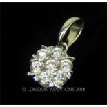 A boxed, 18 ct white gold and diamond-set pendant