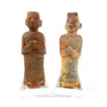 Two middle eastern holy man figures, naively carved from stone, both 27cm high.