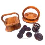 Two, folding, carved wooden bowls with a set of African carved coasters