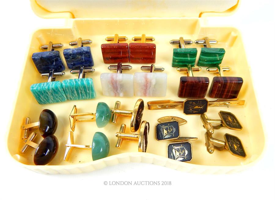 A collection of gilt metal and hard-stone cufflinks
