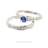 An 18 ct white gold tanzanite and diamond ring with matching half-eternity ring