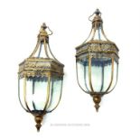 A pair of gilded metal hanging storm lanterns