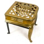 A very large, 19th century, pierced- brass fireside ''Footman'' trivet