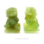 A pair of jadeite Chinese dogs of Fo; 7.5cm high.