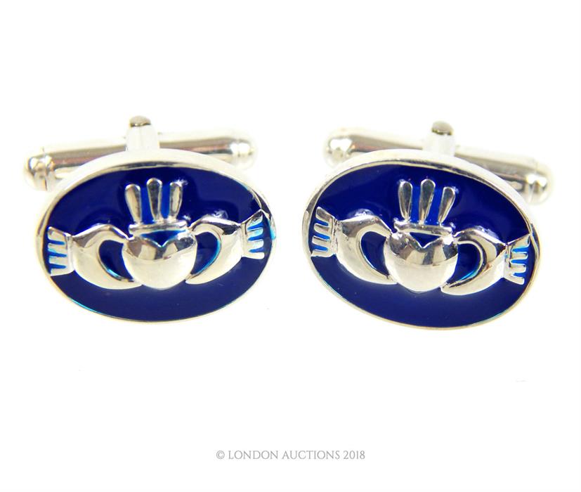 A pair of sterling silver and blue enamel, Welsh cufflinks