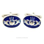 A pair of sterling silver and blue enamel, Welsh cufflinks