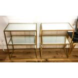 A pair of contemporary, gilt framed console tables with glass tops; 61cm high.