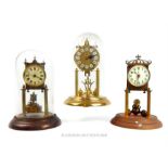 A collection of three anniversary clocks