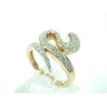 A 9 ct yellow gold, diamond ring in the form of a coiled snake, the snake's body in set with