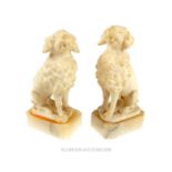 A pair of alabaster seated dogs