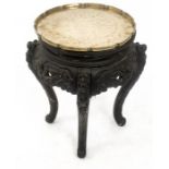 An oriental, ebonised, occasional table with an engraved brass tray top