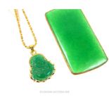 A green hard-stone, gilt metal rectangular pendant with other
