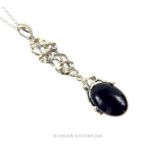 A sterling silver and onyx Art Nouveau-style drop pendant on silver chain