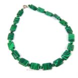 A sterling silver clasped and malachite, beaded necklace