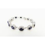 A sterling silver, white crystal and sapphire, cluster bracelet