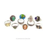 A collection of ten, sterling silver rings and poison rings