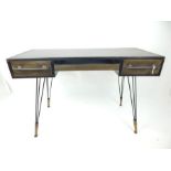 A contemporary, industrial style desk with distressed metal finish; 120cm wide.