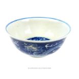 A Chinese, hand-painted, blue and white porcelain bowl decorated with dragons