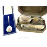 A vintage, boxed, sterling silver, child's brush and comb set with a silver spoon