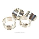 Four HM silver, British Airways Concorde napkin rings; overall 2.4toz.