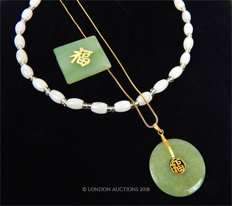 A Chinese green jade pendant with another together with a white stone necklace. - Image 4 of 4