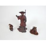 A Chinese spelter figure of a man and other figures