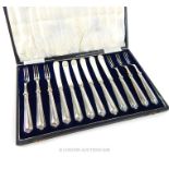 A 1920's, cased set of sterling silver -handled dessert forks and knives