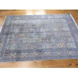 A silk qum rug in shades of blue and silver