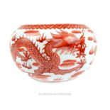 A Chinese ceramic bowl decorated with red dragons; 16cm diameter.