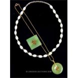 A Chinese green jade pendant with another together with a white stone necklace.