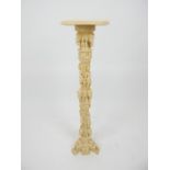 A resin faux ivory jardiniere stand