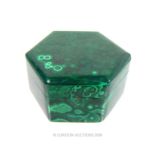 A malachite trinket box of hexagonal form; 7cm diameter.