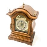 An early 20th century, oak cased, clock with gilded and silvered dial