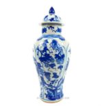 A Chinese Qing style blue and white porcelain vase and cover