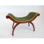 An early 20th century, green-velvet upholstered, carule chair