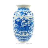 A Chinese blue and white vase decorated with dragons; featuring a Ming style mark; 13.5cm high.