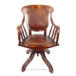 A turn of the last century walnut office chair