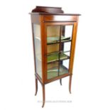 An Edwardian mahogany and line inlaid display cabinet