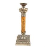 A weighty, white metal and alabaster-columned, Corinthian column candle stick