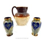 A pair of Royal Doulton stoneware vases and a jug