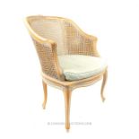 An elegant, French bergere armchair