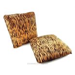 A pair of calf skin (tiger print patterned) and suede cushions from Harrods