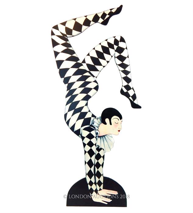 A large, hand-painted, wooden, harlequin sculpture in the Art Deco style