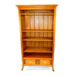 A fruitwood bookcase, having adjustable shelves