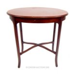 An Edwardian mahogany oval occasional table