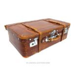 A vintage, brown leather suitcase with chromed fittings