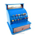 A retro 1960s tin plated toy cash register, over painted in blue; 19cm high.