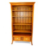 A fruitwood bookcase, having adjustable shelves