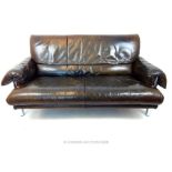 A contemporary brown leather two seater sofa in the Pieff style